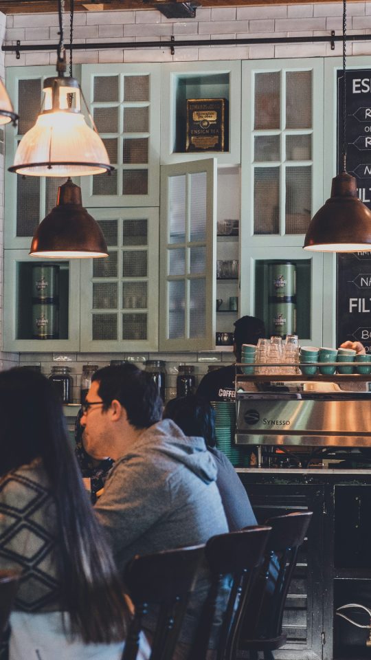 group of people eating on restaurant