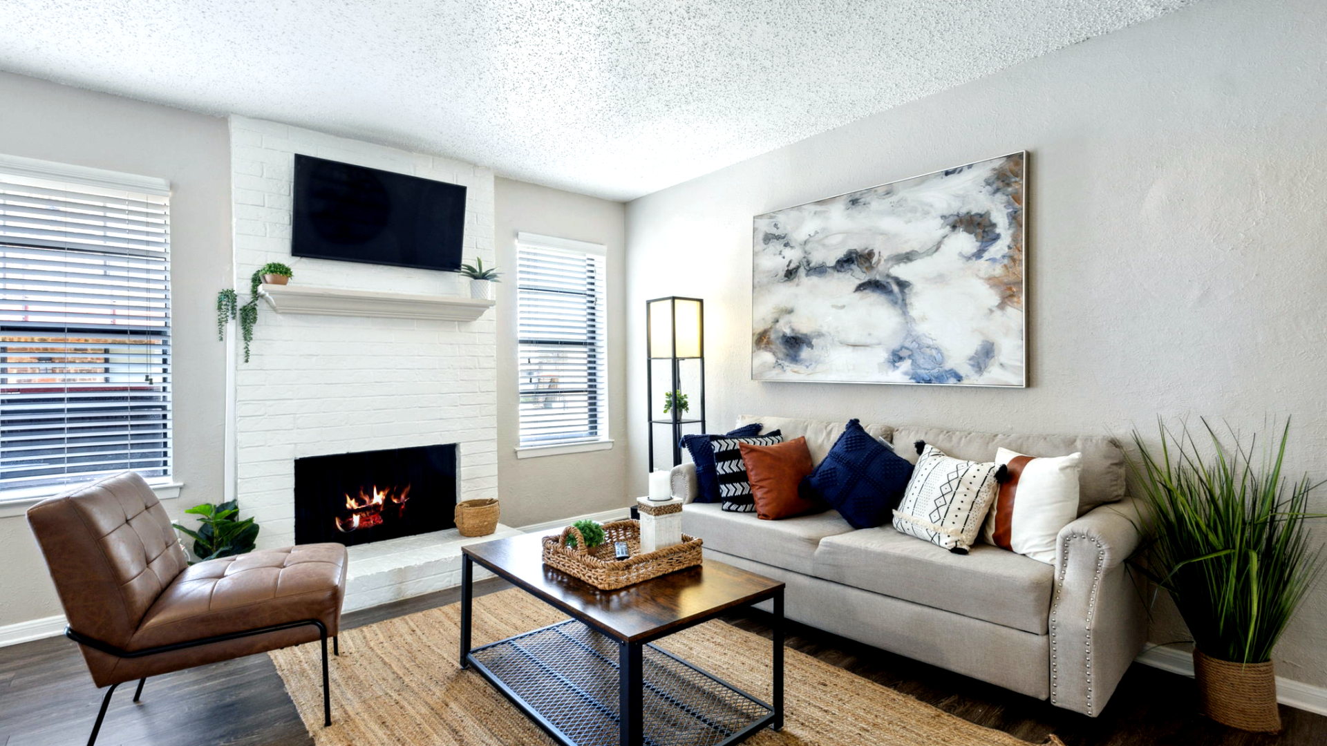 a living room with a fireplace and a couch at The Brookbend