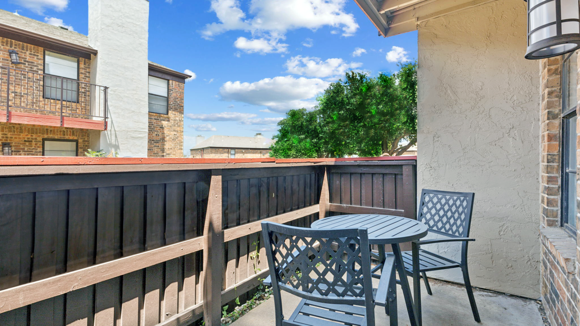 patio with table and chairs overlooking the yard at The Brookbend