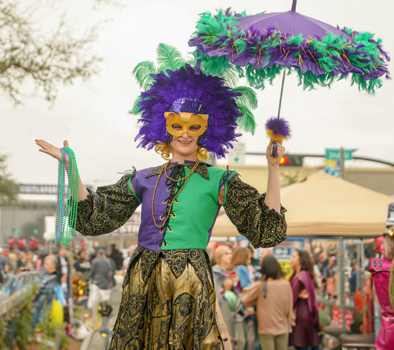 a woman in a costume holding an umbrella at The Brookbend