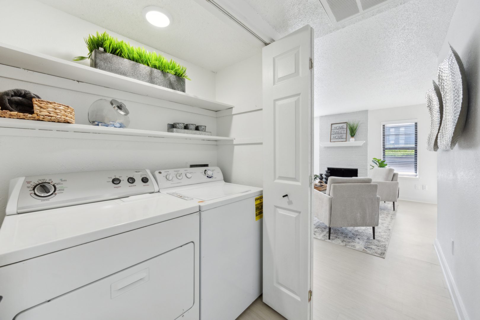 a white washer and dryer in a small room at The Brookbend