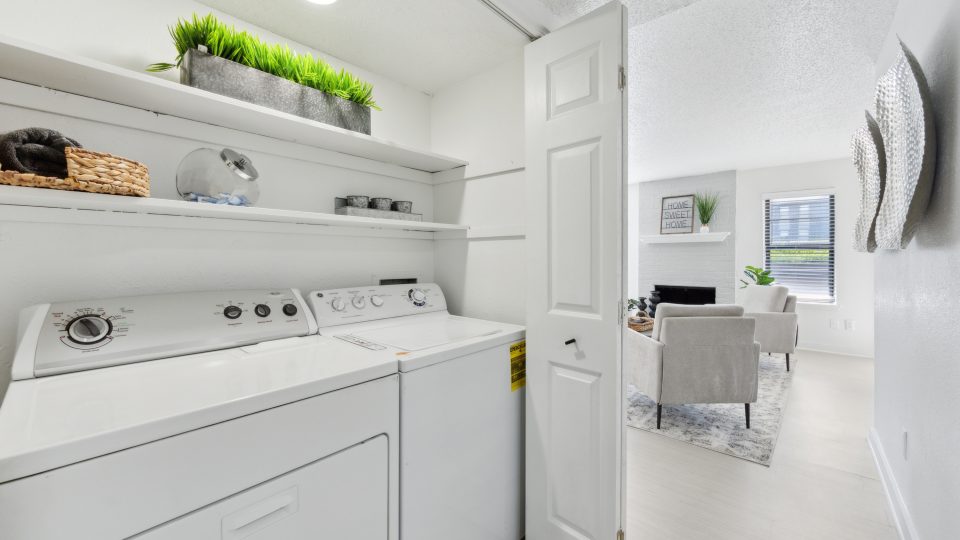 a white washer and dryer in a small room at The Brookbend